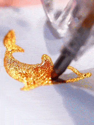 Glitter gel pen creating a sparkling drawing